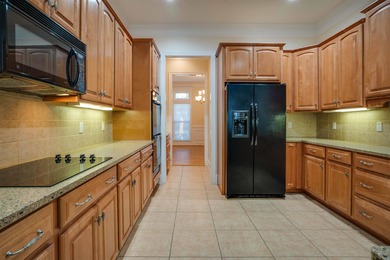 This stunning custom home in Southwood on Grove Park Dr on Southwood Golf Club in Florida - for sale on GolfHomes.com, golf home, golf lot