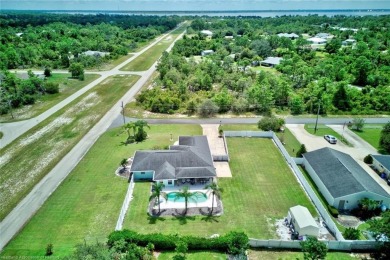 Staycation in your own backyard. Your own tropical paradise on Placid Lakes Country Club in Florida - for sale on GolfHomes.com, golf home, golf lot