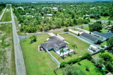 Staycation in your own backyard. Your own tropical paradise on Placid Lakes Country Club in Florida - for sale on GolfHomes.com, golf home, golf lot