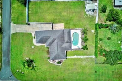 Staycation in your own backyard. Your own tropical paradise on Placid Lakes Country Club in Florida - for sale on GolfHomes.com, golf home, golf lot