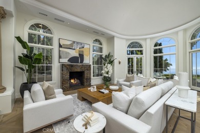 Situated on a prized front-row lot, this Pelican Crest showpiece on Pelican Hill Golf Club in California - for sale on GolfHomes.com, golf home, golf lot