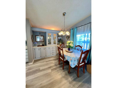 Charming, Fully Furnished Home - Move-In Ready! Step into on Lake Henry Golf Club in Florida - for sale on GolfHomes.com, golf home, golf lot