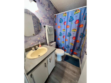 Charming, Fully Furnished Home - Move-In Ready! Step into on Lake Henry Golf Club in Florida - for sale on GolfHomes.com, golf home, golf lot