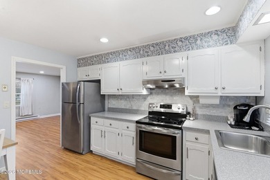 This end unit Barnett model offers a convenient location near on Leisure Village East in New Jersey - for sale on GolfHomes.com, golf home, golf lot