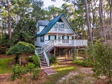 Fall in love with this cozy three bedroom, two bath home tucked on Isle Dauphine Club Golf Course in Alabama - for sale on GolfHomes.com, golf home, golf lot