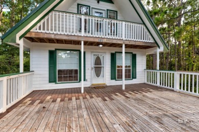 Fall in love with this cozy three bedroom, two bath home tucked on Isle Dauphine Club Golf Course in Alabama - for sale on GolfHomes.com, golf home, golf lot