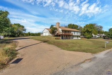 Discover this delightful home with picturesque views of the on Lake Perry Country Club in Kansas - for sale on GolfHomes.com, golf home, golf lot