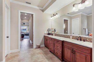 Welcome to your dream home--an elegant three-bedroom on Lakewood Ranch Golf and Country Club in Florida - for sale on GolfHomes.com, golf home, golf lot