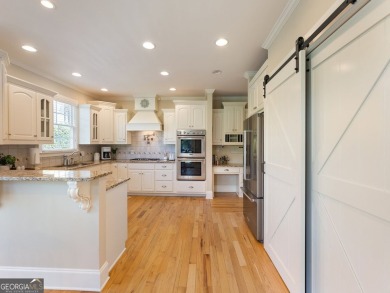 Welcome home to 70 Baker Pond Ct - a rare and timeless retreat on Traditions of Braselton Golf Club in Georgia - for sale on GolfHomes.com, golf home, golf lot
