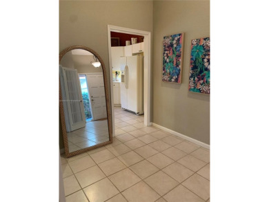 NEW TO THE MARKET 3/2 PONDVIEW HOME IN PRESTIGIOUS CANTERBURY on PGA National Golf Club in Florida - for sale on GolfHomes.com, golf home, golf lot