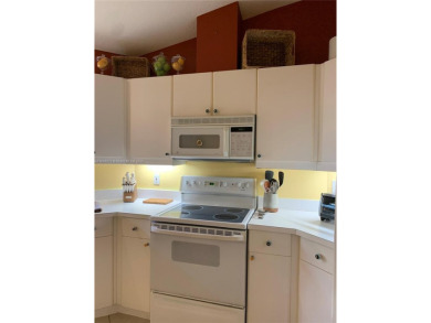 NEW TO THE MARKET 3/2 PONDVIEW HOME IN PRESTIGIOUS CANTERBURY on PGA National Golf Club in Florida - for sale on GolfHomes.com, golf home, golf lot