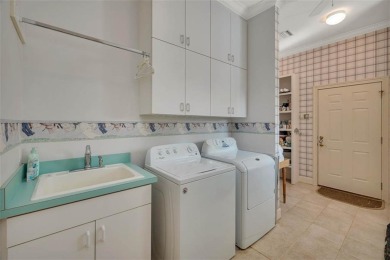 Enjoy lagoon views in this elegant island retreat nestled in the on Sea Island Golf Club in Georgia - for sale on GolfHomes.com, golf home, golf lot