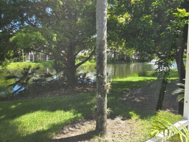 NEW TO THE MARKET 3/2 PONDVIEW HOME IN PRESTIGIOUS CANTERBURY on PGA National Golf Club in Florida - for sale on GolfHomes.com, golf home, golf lot