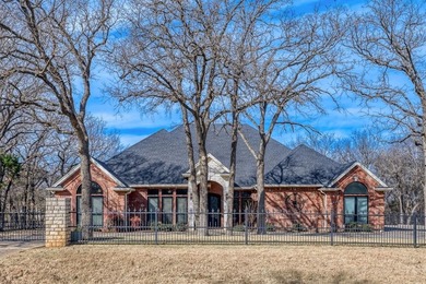 Gorgeous 4-bedroom, 3-bathroom home totaling 3,373 square feet on Pecan Plantation Country Club in Texas - for sale on GolfHomes.com, golf home, golf lot