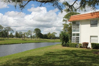 2nd Floor End Unit with Gorgeous, unobstructed Water & Golf on Pine Lakes Golf Club in Florida - for sale on GolfHomes.com, golf home, golf lot