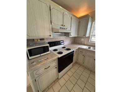 2nd Floor End Unit with Gorgeous, unobstructed Water & Golf on Pine Lakes Golf Club in Florida - for sale on GolfHomes.com, golf home, golf lot