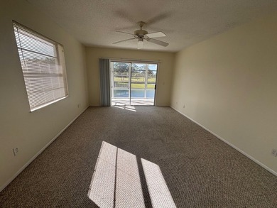 2nd Floor End Unit with Gorgeous, unobstructed Water & Golf on Pine Lakes Golf Club in Florida - for sale on GolfHomes.com, golf home, golf lot