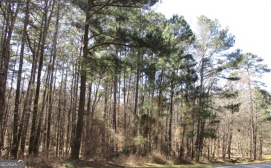 Come build your dream home on this interior wooded lot in on Reynolds Lake Oconee - The Landing in Georgia - for sale on GolfHomes.com, golf home, golf lot