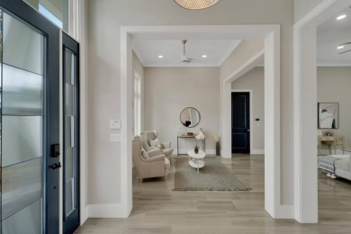 Welcome to 5713 Tybee Island Drive, a stunning newer on Apollo Beach Golf and Sea Club in Florida - for sale on GolfHomes.com, golf home, golf lot