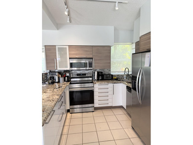 Fabulous 4 bed 3 bath home in prestigious Tiffany Trace located on The Boca Country Club in Florida - for sale on GolfHomes.com, golf home, golf lot