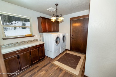 This beautiful single-level home sits on the Priest Lake Golf on Priest Lake Golf and Tennis Club in Idaho - for sale on GolfHomes.com, golf home, golf lot