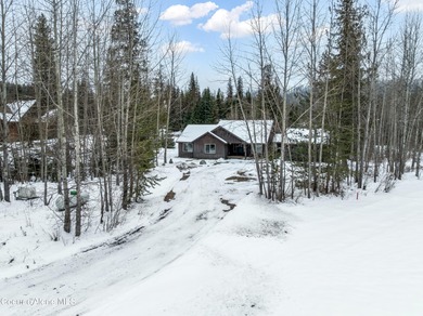 This beautiful single-level home sits on the Priest Lake Golf on Priest Lake Golf and Tennis Club in Idaho - for sale on GolfHomes.com, golf home, golf lot