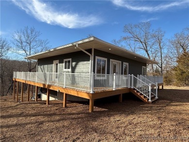 Experience unparalleled luxury living at the Estates of on The Club At Old Kinderhook in Missouri - for sale on GolfHomes.com, golf home, golf lot