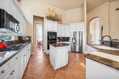 Exceptional courtyard estate perfectly positioned on a premium on  in Florida - for sale on GolfHomes.com, golf home, golf lot