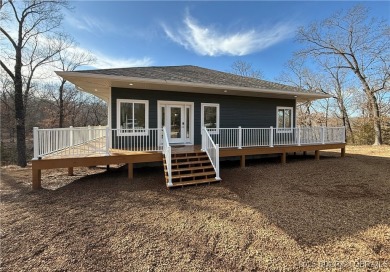 Experience unparalleled luxury living at the Estates of on The Club At Old Kinderhook in Missouri - for sale on GolfHomes.com, golf home, golf lot