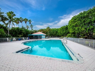 Under contract-accepting backup offers. Revel in unparalleled on Longboat Key Golf Club in Florida - for sale on GolfHomes.com, golf home, golf lot