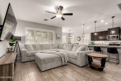 This well-appointed home pairs refined interior finishes with on The Golf Club At Johnson Ranch in Arizona - for sale on GolfHomes.com, golf home, golf lot