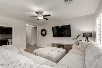 This well-appointed home pairs refined interior finishes with on The Golf Club At Johnson Ranch in Arizona - for sale on GolfHomes.com, golf home, golf lot