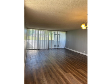 **SPACIOUS AND BRIGHT 3/2 - COMPLETELY RENOVATED FIRST FLOOR on Inverrary Country Club in Florida - for sale on GolfHomes.com, golf home, golf lot