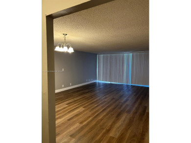 **SPACIOUS AND BRIGHT 3/2 - COMPLETELY RENOVATED FIRST FLOOR on Inverrary Country Club in Florida - for sale on GolfHomes.com, golf home, golf lot
