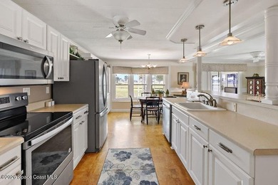 2bed/2bath home with a lovely golf course view in Barefoot Bay! on Barefoot Bay Golf Course in Florida - for sale on GolfHomes.com, golf home, golf lot