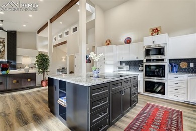 Experience turn-key, main-level living in the gated Kissing on Kissing Camels Golf Course in Colorado - for sale on GolfHomes.com, golf home, golf lot