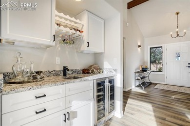 Experience turn-key, main-level living in the gated Kissing on Kissing Camels Golf Course in Colorado - for sale on GolfHomes.com, golf home, golf lot