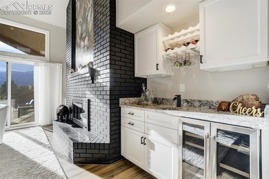 Experience turn-key, main-level living in the gated Kissing on Kissing Camels Golf Course in Colorado - for sale on GolfHomes.com, golf home, golf lot