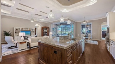 Positioned on a premier homesite with water on two sides and on Ritz-Carlton Members Golf Club in Florida - for sale on GolfHomes.com, golf home, golf lot