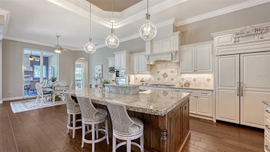 Positioned on a premier homesite with water on two sides and on Ritz-Carlton Members Golf Club in Florida - for sale on GolfHomes.com, golf home, golf lot