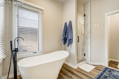 Experience turn-key, main-level living in the gated Kissing on Kissing Camels Golf Course in Colorado - for sale on GolfHomes.com, golf home, golf lot