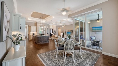 Positioned on a premier homesite with water on two sides and on Ritz-Carlton Members Golf Club in Florida - for sale on GolfHomes.com, golf home, golf lot