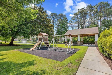 Coastal living in Pawley's Island. Charming home nestled in on The Founders Club At Pawleys Island in South Carolina - for sale on GolfHomes.com, golf home, golf lot