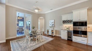 Positioned on a premier homesite with water on two sides and on Ritz-Carlton Members Golf Club in Florida - for sale on GolfHomes.com, golf home, golf lot