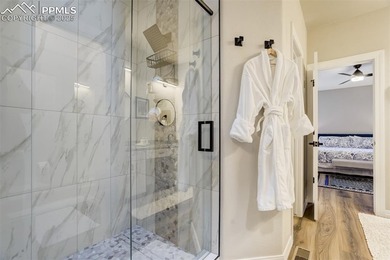 Experience turn-key, main-level living in the gated Kissing on Kissing Camels Golf Course in Colorado - for sale on GolfHomes.com, golf home, golf lot