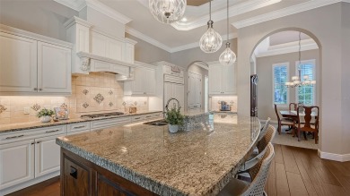 Positioned on a premier homesite with water on two sides and on Ritz-Carlton Members Golf Club in Florida - for sale on GolfHomes.com, golf home, golf lot