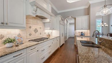 Positioned on a premier homesite with water on two sides and on Ritz-Carlton Members Golf Club in Florida - for sale on GolfHomes.com, golf home, golf lot