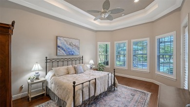 Positioned on a premier homesite with water on two sides and on Ritz-Carlton Members Golf Club in Florida - for sale on GolfHomes.com, golf home, golf lot