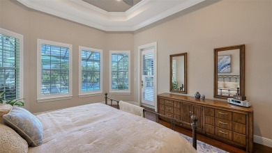 Positioned on a premier homesite with water on two sides and on Ritz-Carlton Members Golf Club in Florida - for sale on GolfHomes.com, golf home, golf lot