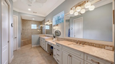 Positioned on a premier homesite with water on two sides and on Ritz-Carlton Members Golf Club in Florida - for sale on GolfHomes.com, golf home, golf lot